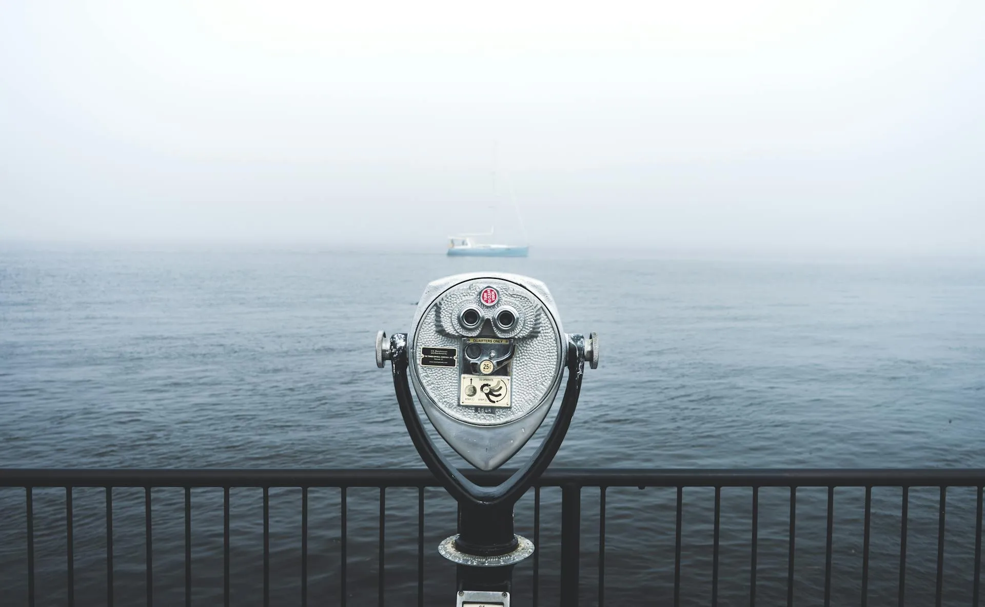 A telescope looking at a waterfront